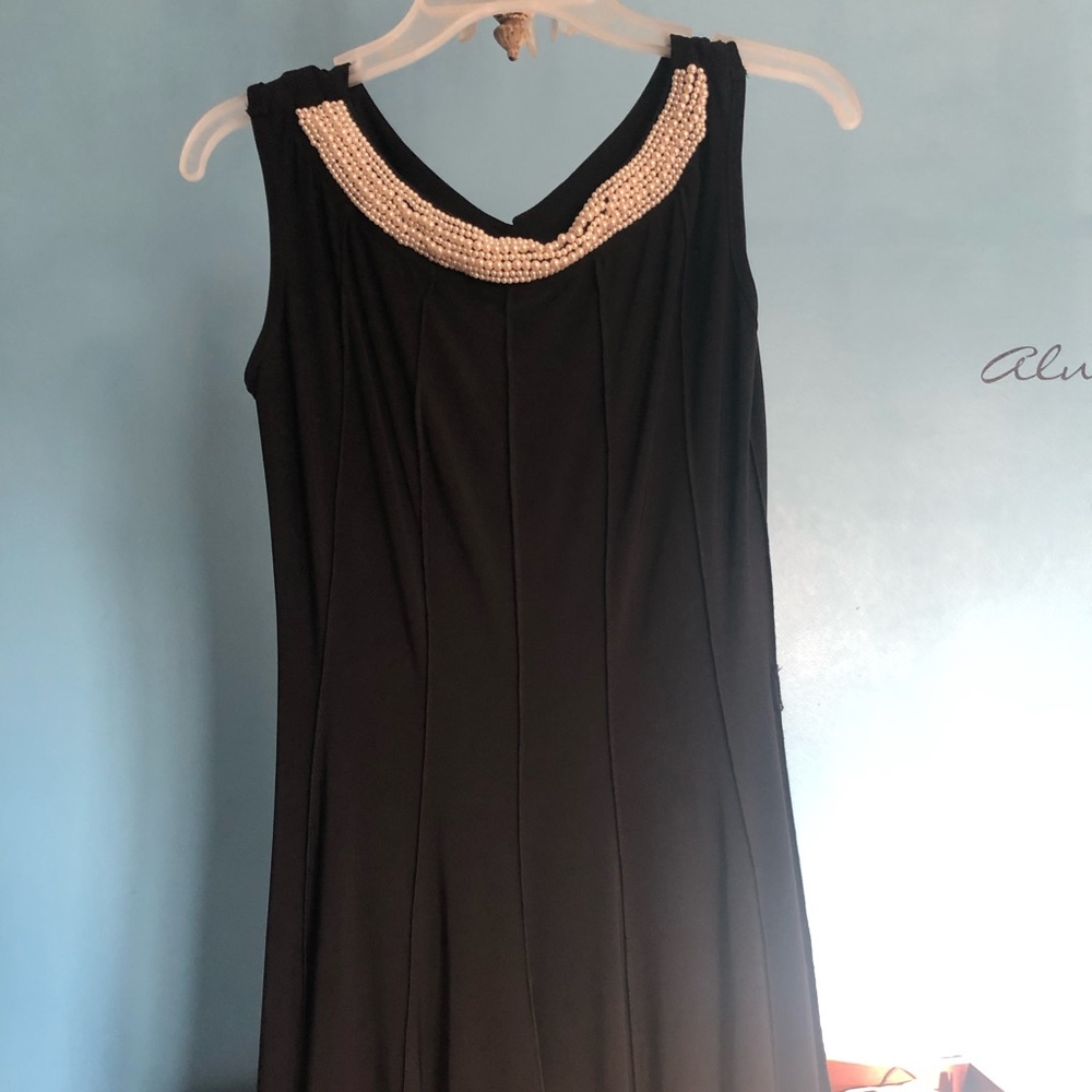 Black dress with pearl collar. Very form fitting and comfortable!